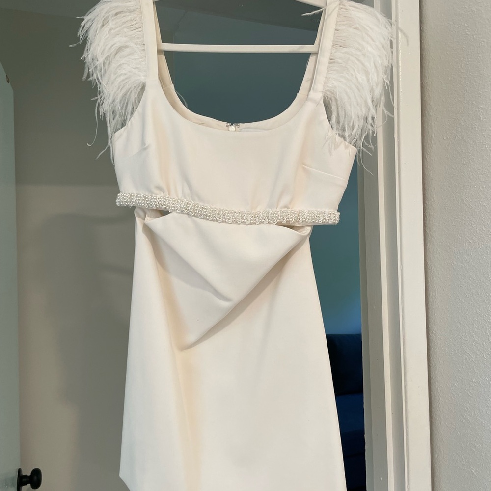 Likely White Dress with Elegant Details